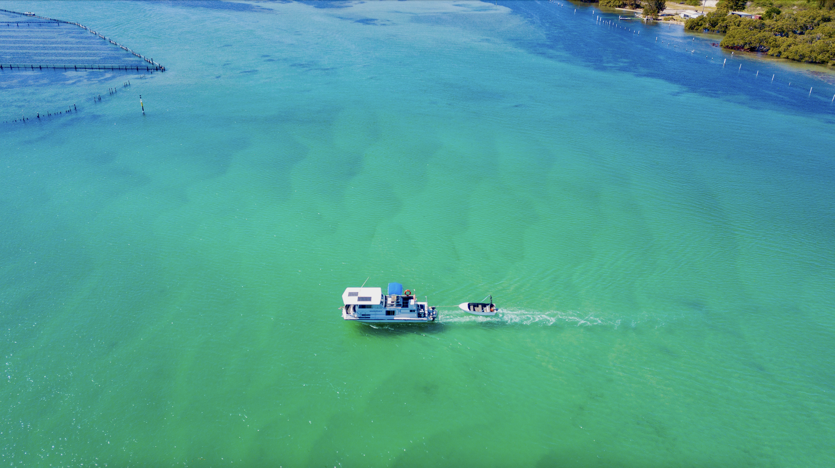 Luxury BBQ pontoon boat on the blue waters of Wallis Lake, Forster